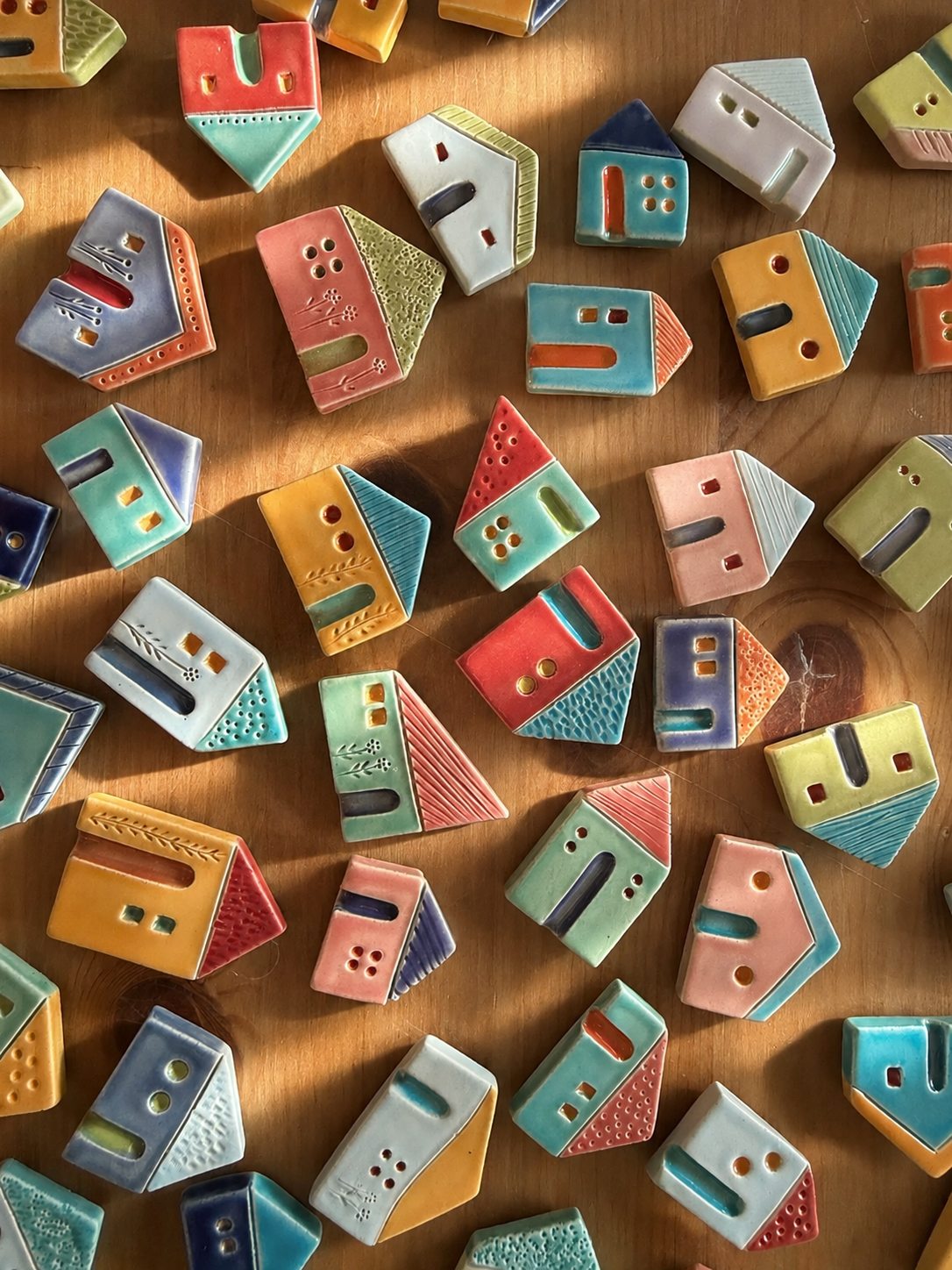 Small handmade ceramic houses in the studio